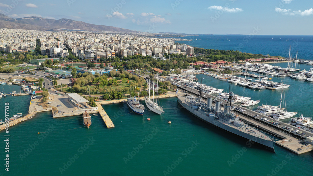Aerial drone bird's eye view of small port and Park of Maritime Tradition where historic Averof warship is docked, Floisvos, Faliro Marina, Attica, Greece
