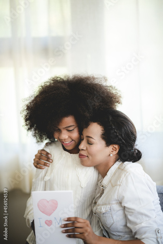 American African children and mother family are happy together with love of daughter girl who woman people childhood lifestyle, afro motherhood stay at home with family activity