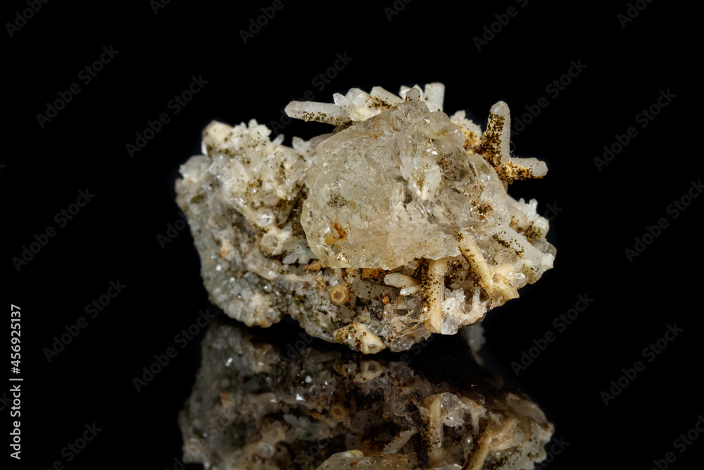 Macro mineral stone fluorite with quartz against black background Macro mineral stone fluorite with quartz against black background