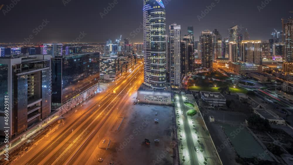 Dubai's business bay towers aerial night timelapse. Rooftop view of some skyscrapers