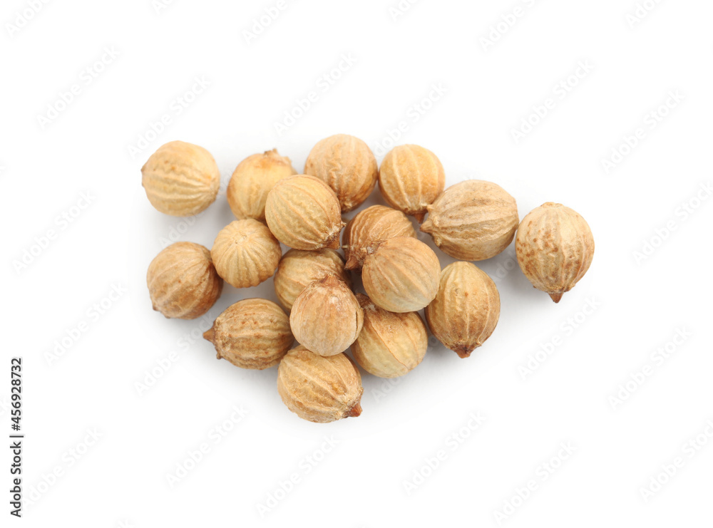 Heap of dried coriander seeds on white background, top view Heap of dried coriander seeds on white background, top view