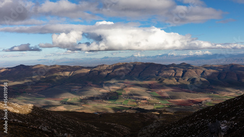 View from the top of Swartberg mountain pass to the farms below photo