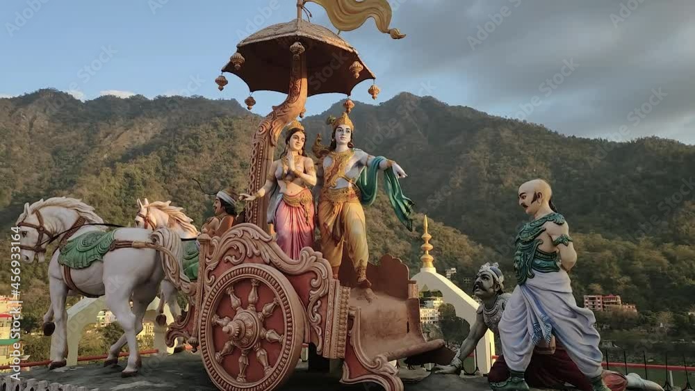 A sculpture group based on the Mahabharata in a Hindu temple in Rishikesh. A beautiful couple in a festive chariot