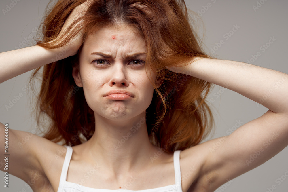 Fototapeta premium beautiful woman magnifier near the face hygiene isolated background