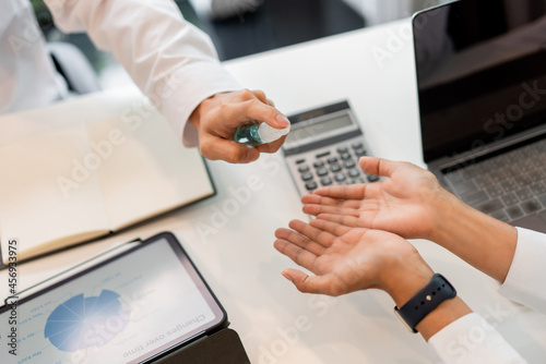 Wallpaper Mural frequent spraying hand sanitizer supporting to reduce the risk of virus epidemic covid-19 at the workplace Torontodigital.ca