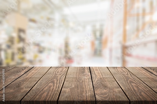 Empty wooden table in front of abstract blurred background. display of product