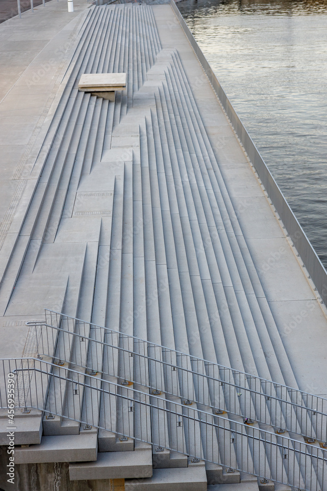 Fototapeta premium A fragment of the steps going into the water.