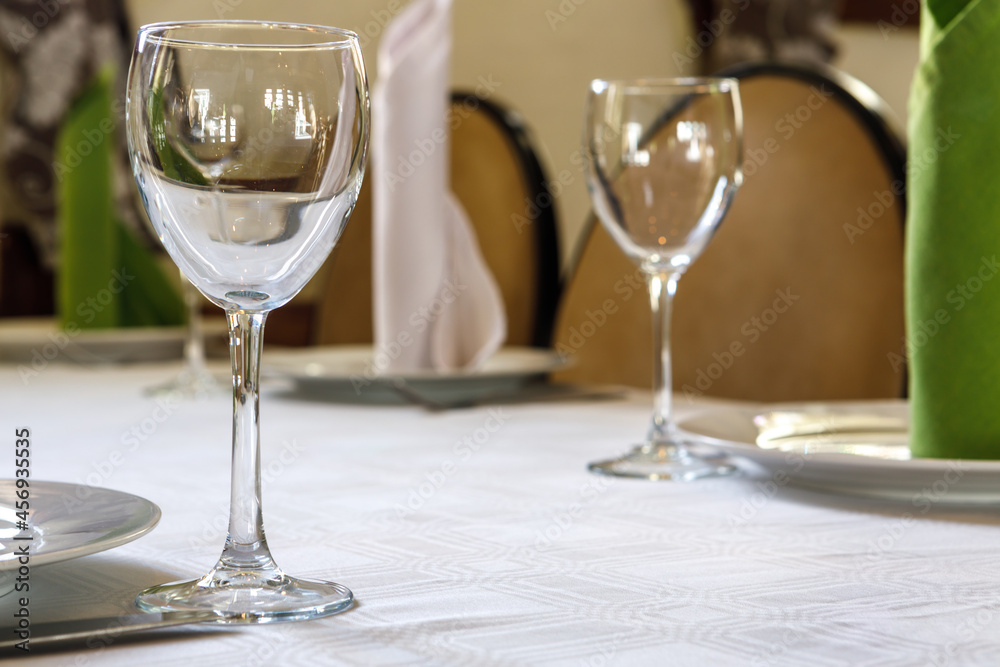 Empty glasses are on the table. A fragment of the serving.