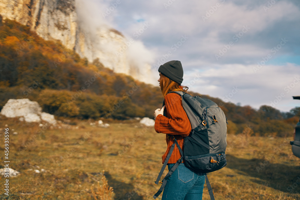 woman tourist with cutter near mountains travel landscape adventure