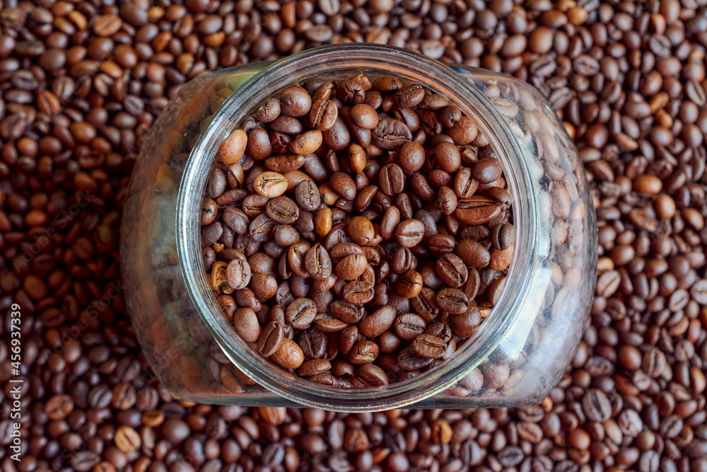 A jar completely filled with coffee beans. A jar completely filled with coffee beans.