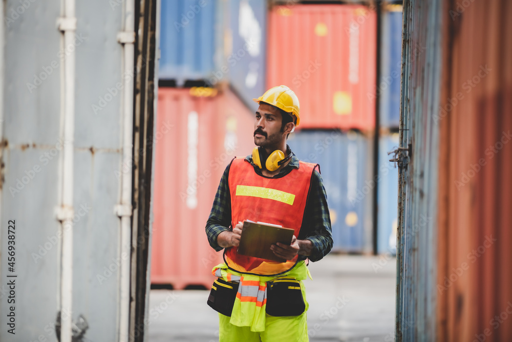 foreman or engineer are work in container shipping industry warehouse, logistic transport to import and export cargo at delivery storage port terminal, man are work to control a business box foreman or engineer are work in container shipping industry warehouse, logistic transport to import and export cargo at delivery storage port terminal, man are work to control a business box