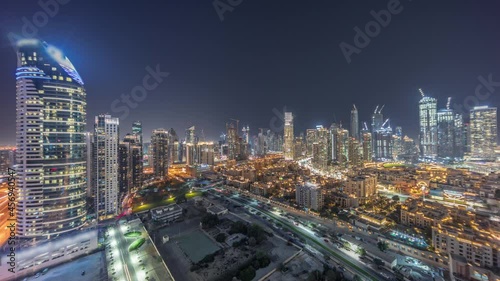 Wallpaper Mural Dubai's business bay towers aerial night timelapse. Rooftop view of some skyscrapers Torontodigital.ca