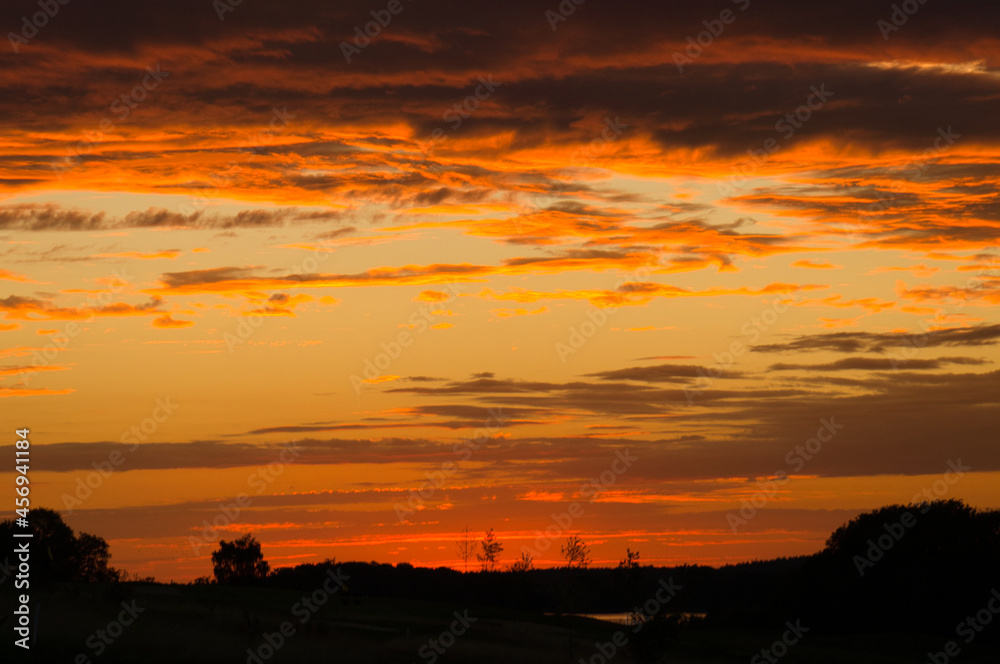 burning sky. Sunset with extreme colors. clouds and light atmosphere