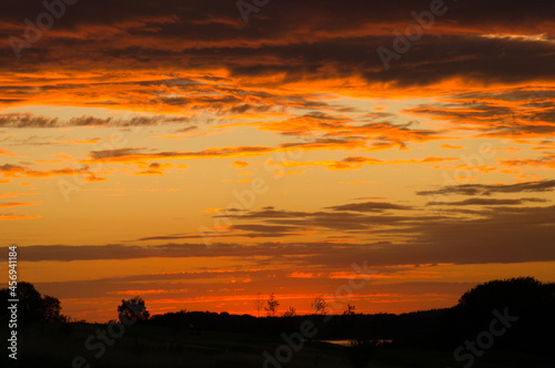 burning sky. Sunset with extreme colors. clouds and light atmosphere © Martin
