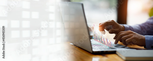 Financial Business men analyze the graph of the company's performance to create profits and growth,Market research reports and income statistics,double exposure with Financial Accounting concept.