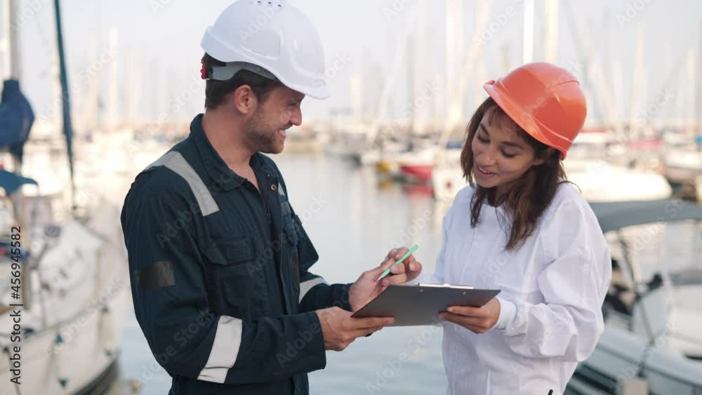 Port surveyor checks ship registration documents Port surveyor checks ship registration documents