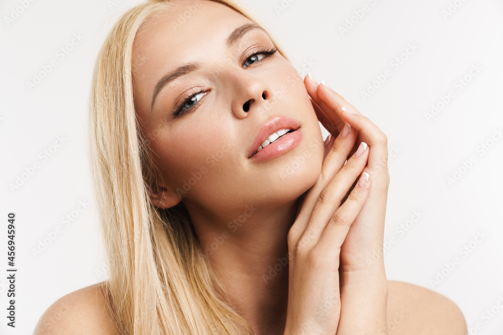Half-naked blonde woman posing and looking at camera Half-naked blonde woman posing and looking at camera