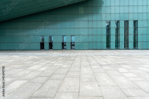 The empty floor of the square and the exterior walls of modern buildings