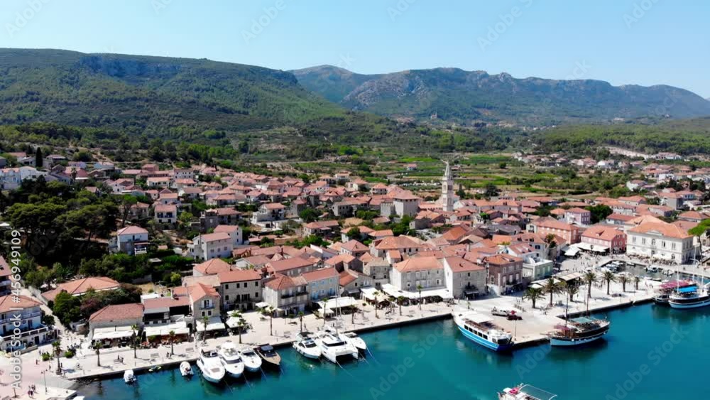 Drone shot on the Croatian resort island of Hvar in the Adriatic Sea. View from the drone to the port. Boats and ships on the shores of the Adriatic Sea in Croatia. Mountains on the island of Hvar. Drone shot on the Croatian resort island of Hvar in the Adriatic Sea. View from the drone to the port. Boats and ships on the shores of the Adriatic Sea in Croatia. Mountains on the island of Hvar.