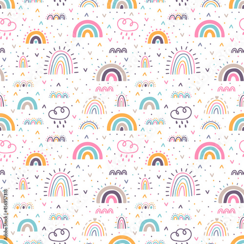 Cute seamless pattern with rainbows. Hand drawn nursery design. Trendy baby texture for fabric, cloth, textile, wrapping paper