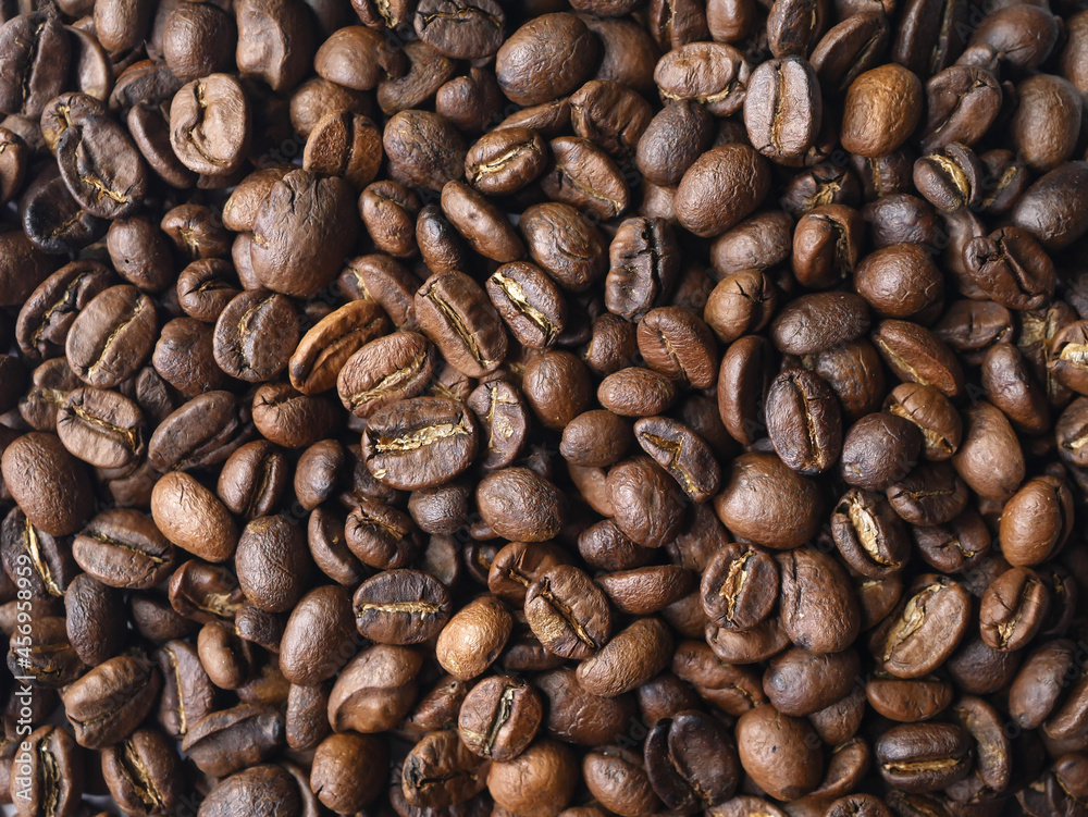 Fototapeta premium Background of medium roast coffee beans 