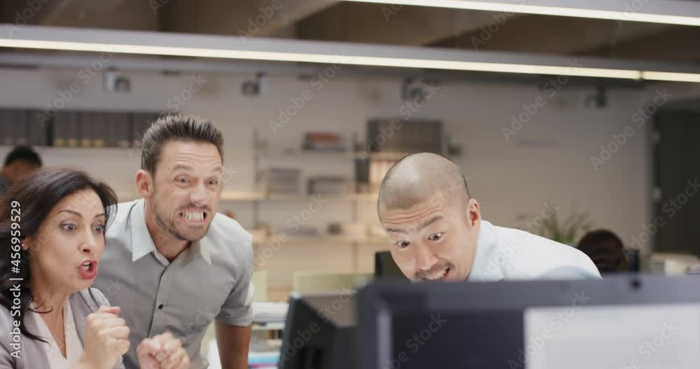 Diverse business team celebrating victory arms raised extreme happiness excitement at corporate success winning goal Diverse business team celebrating victory arms raised extreme happiness excitement at corporate success winning goal