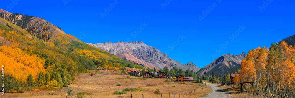 Panoramic view of Ophir mining town in middle of San Juan mountains during autumn time. Panoramic view of Ophir mining town in middle of San Juan mountains during autumn time.