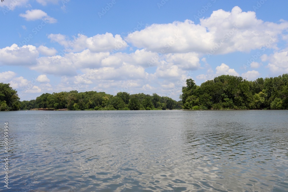 A beautiful view of the flowing river on a sunny day. A beautiful view of the flowing river on a sunny day.