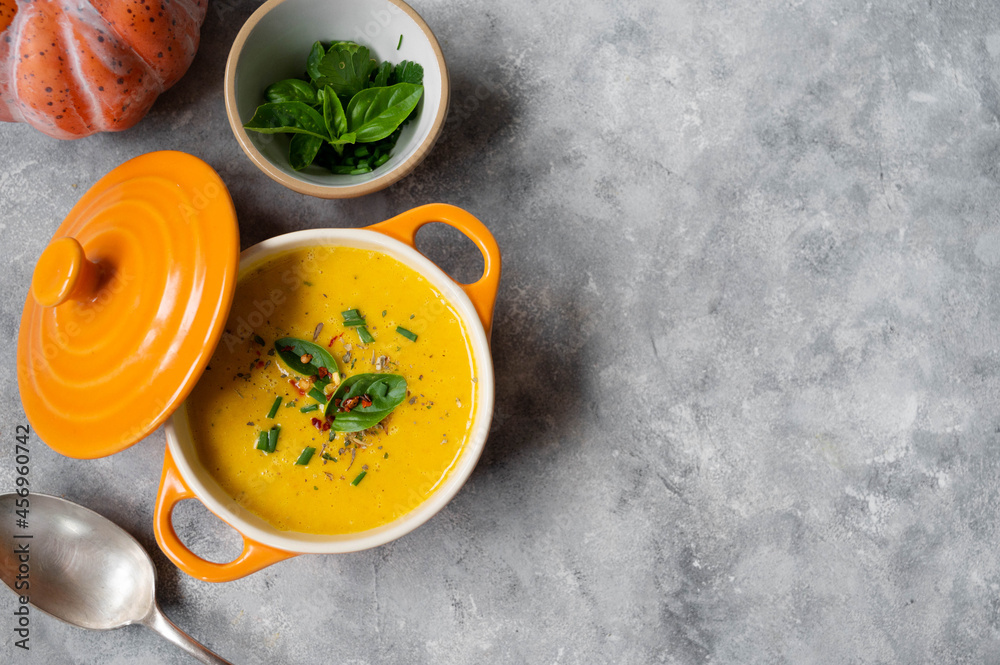 Pumpkin soup made from fresh orange butternut with coconut milk. Delicious vegan, seasonal autumn food. Pumpkin soup made from fresh orange butternut with coconut milk. Delicious vegan, seasonal autumn food.