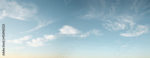 Panorama of blue sky with wispy clouds