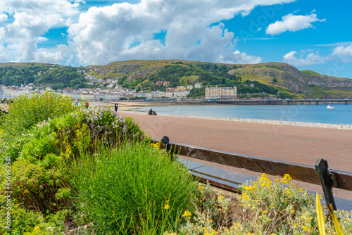View of Llandudno Pier and the Great Orme in background from Promenade, Llandudno, Conwy County, North Wales photo
