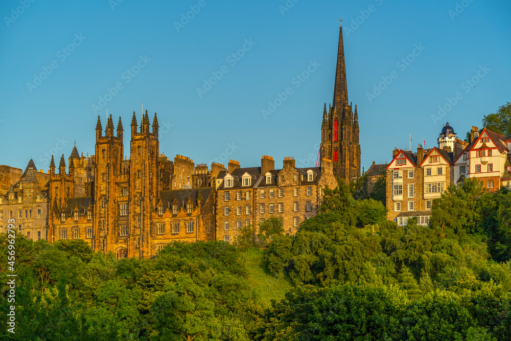 View of New College, The University of Edinburgh, on The Mound, from Princes Street at sunset View of New College, The University of Edinburgh, on The Mound, from Princes Street at sunset