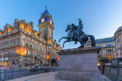 View of The Balmoral Hotel and statue of Arthur Wellesley (1st Duke of Wellington) at dusk photo