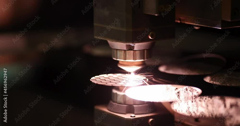 Sparks from automatic laser cutting or engraving of parts 4k movie Sparks from automatic laser cutting or engraving of parts 4k movie