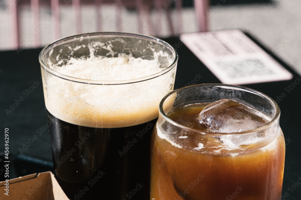 Two Glasses of Cold Brew Coffee, one of them with nitro ant the other with milk Two Glasses of Cold Brew Coffee, one of them with nitro ant the other with milk