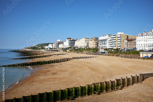 Eastbourne beach and Hotels, East Sussex, England. A summertime view across the seafront of the English seaside town with South Downs in the distance.