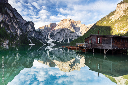 Lake Braies (Pragser Wildsee) at sunrise with Croda del Becco mountain reflected in water, Dolomites, South Tyrol photo