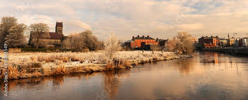A frosted river at sunrise in the town of Galway, County Galway, Connacht, Republic of Ireland photo