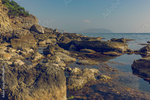 Stony Crimean coast in autumn. Crimea. Calm sea surface. you feel calm and peace of mind.