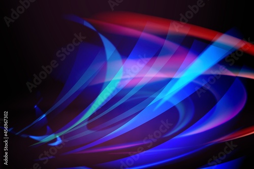 Beautiful colorful light effect of neon glow lights and flash on a dark background