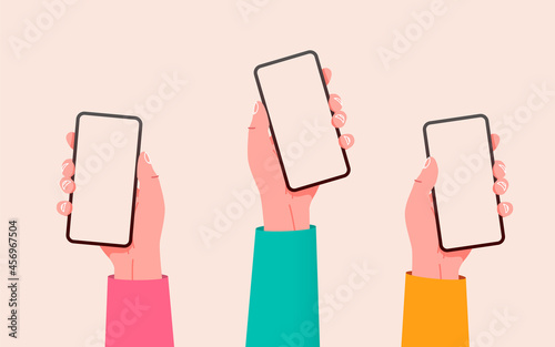 Flat vector hands with phones. Hands holding phones with empty screens mock up. Social media interaction. Social network communication