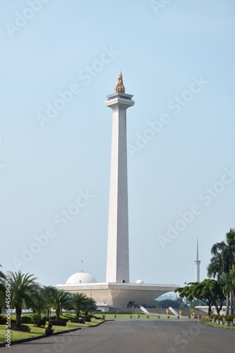 The National Monument (Monumen Nasional) in Jakarta, Indonesia, in daylight, in the afternoon, from a far, showing full view of the monument.
