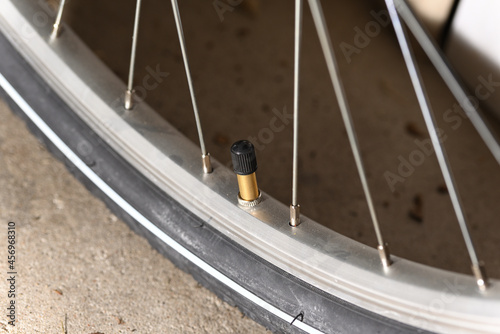Schrader valve bicycle and bicycle wheel with spokes. photo