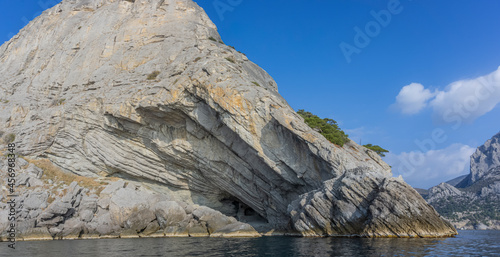 Stony coast of Crimea. Mount Koba Kaya. View from the sea. On the right is a grotto named after Prince Golitsyn. He is a great Russian winemaker of the 19th and 20th centuries.