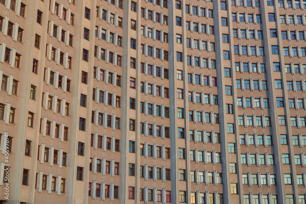 old USSR architecture huge building background with concrete wall perspective surface and a lot of window