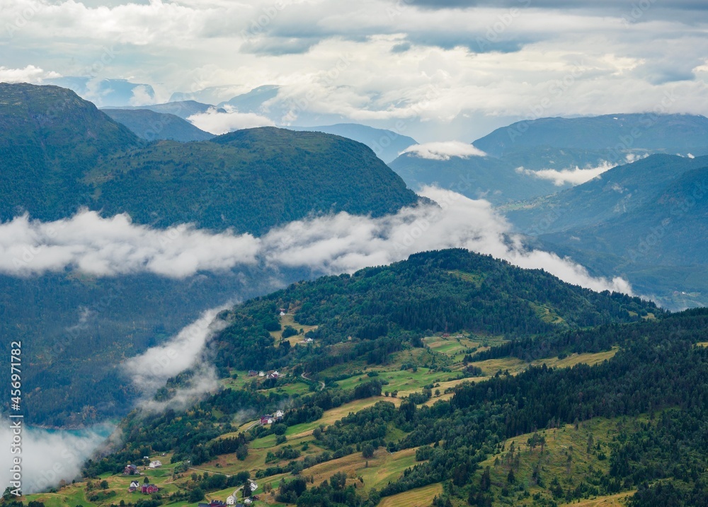 Views of foggy mountains meadows from Molden hike in Norway