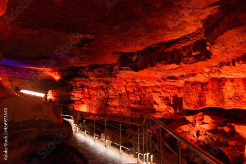 SATAPLIA, KUTAISI, GEORGIA: Sataplia cave in Georgia illuminated by colorful lights.