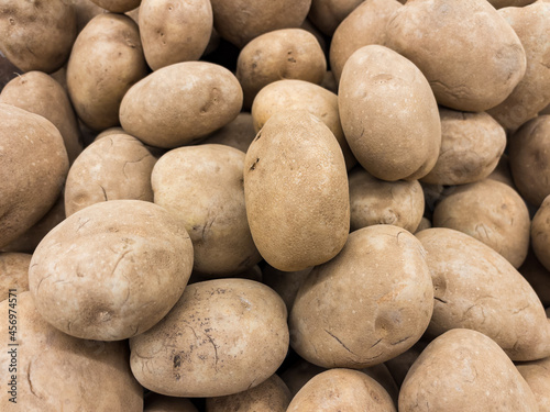 Idaho russet potatoes on display at grocery store market. photo