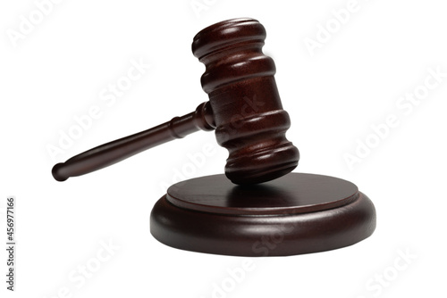 Wooden judge gavel and soundboard isolated on a white background.