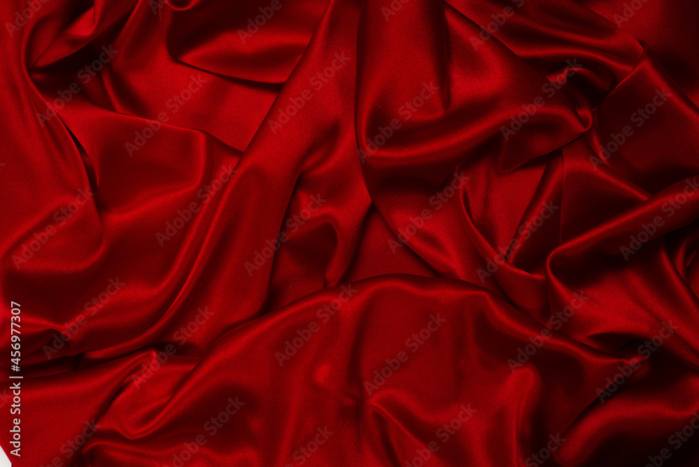 Rich and luxury red silk fabric texture background. Rich and luxury red silk fabric texture background.